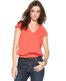This peasant-inspired top from DKNY Jeans features metallic-tinged fabric and a smocked hem for bohemian style. Pair it with your favorite jeans for a look that works all season! This peasant-inspired top from DKNY Jeans features metallic-tinged fabric and a smocked hem for bohemian style. Pair it with your favorite jeans for a look that works all season!