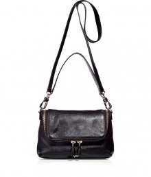 Edgy-cool zip details and super shiny leather add a downtown-ready attitude to this versatile bag from cult-favorite accessory designer Anya Hindmarch - Front flap with dual-zip pocket, convertible carrying handle and shoulder strap, back zip pocket - Perfect for toting around your daily essentials, work, or stylish travel Edgy-cool zip details and super shiny leather add a downtown-ready attitude to this versatile bag from cult-favorite accessory designer Anya Hindmarch - Front flap with dual-zip pocket, convertible carrying handle and shoulder strap, back zip pocket - Perfect for toting around your daily essentials, work, or stylish travel