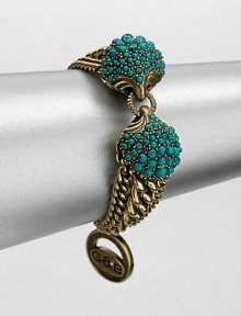 A Hellenic-inspired design that features a turquoise cabochon encrusted station and antique-finished brass link chains. TurquoiseAntique-finished brassLength, about 7.5Spring ring closureImported 