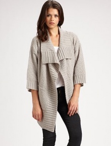 Comfy, textured design with a cropped back hem, shawl collar and bow-tie stitching. Shawl collar Open front Three-quarter sleeves Cropped back hem 85% acrylic/15% nylon Hand wash Imported Comfy, textured design with a cropped back hem, shawl collar and bow-tie stitching. Shawl collar Open front Three-quarter sleeves Cropped back hem 85% acrylic/15% nylon Hand wash Imported