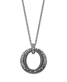 The name speaks for itself. You'll be stunned by Eliot Danori's Star Struck Circle Pendant. A cut-out circle shines with the addition of sparkling crystals. Crafted in anthracite tone mixed metal. Approximate length: 36 inches. Approximate drop: 1-1/2 inches. The name speaks for itself. You'll be stunned by Eliot Danori's Star Struck Circle Pendant. A cut-out circle shines with the addition of sparkling crystals. Crafted in anthracite tone mixed metal. Approximate length: 36 inches. Approximate drop: 1-1/2 inches.