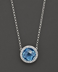 Blend some cool blues into your look. This stunning blue topaz pendant necklace features gleaming diamond accents on 14 Kt. white gold.