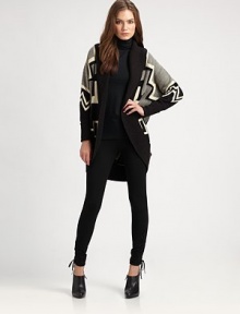 A bold and artful design of Southwestern motifs in a luxurious blend of wool, cashmere and silk with a long, contour shape.Wide, ribbed shawl collarOpen front with ribbed placketLong dolman sleeves with ribbed cuffsContour hemAbout 31 from shoulder to hemWool/silk/cashmereDry cleanImported of Italian yarnsSIZE & FITModel shown is 5'10 (177cm) wearing US size Small. A bold and artful design of Southwestern motifs in a luxurious blend of wool, cashmere and silk with a long, contour shape.Wide, ribbed shawl collarOpen front with ribbed placketLong dolman sleeves with ribbed cuffsContour hemAbout 31 from shoulder to hemWool/silk/cashmereDry cleanImported of Italian yarnsSIZE & FITModel shown is 5'10 (177cm) wearing US size Small.