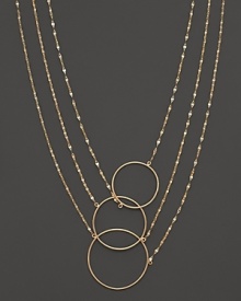 Interlocking circles and gleaming chains of 14K yellow gold. By Lana.