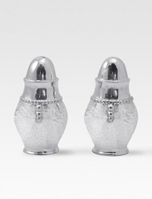 A handmade set of salt and pepper shakers in hammered, sandcast aluminum, buffed by hand for unparalleled shine and elegance. Set of 2 Each, 3½H X 1¾ diam. Sandcast aluminum Hand wash Imported A handmade set of salt and pepper shakers in hammered, sandcast aluminum, buffed by hand for unparalleled shine and elegance. Set of 2 Each, 3½H X 1¾ diam. Sandcast aluminum Hand wash Imported