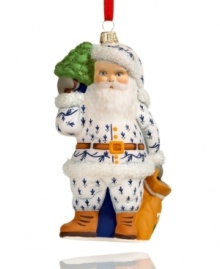 Filled with the charm of Christmas past, this Vaillancourt Santa Claus ornament is hand painted in a blue and white suit and trimmed in shimmering green and white glitter.