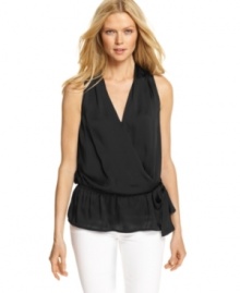 A ruffled peplum hem and loose fit makes this MICHAEL Michael Kors top ideal for a breezy spring look!