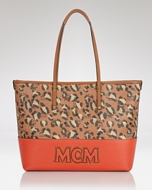 Give your look an punch of print with this tote from MCM. Made from coated canvas and splashed with spots, it boasts a look that's ready for work or play. Give your look an punch of print with this tote from MCM. Made from coated canvas and splashed with spots, it boasts a look that's ready for work or play.