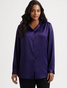 A touch of stretch gives this satin button-down must-wear status. Pair this style with your favorite pants or jeans. Collar neckLong sleevesButton cuffsButton-front styleSolid frontPrinted backBack yokePrincess seams on printed backAbout 28 from shoulder to hemPolyester/elastaneDry cleanImported