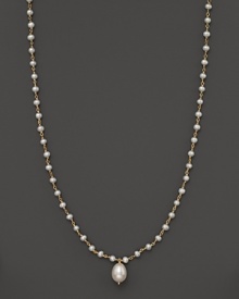 An iridescent freshwater pearl necklace with center pearl drop.