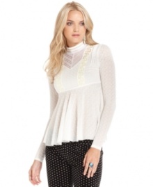 Inspired by romantic Victorian style, this allover lace Free People top features a ruffled body that's oh-so hot for fall!