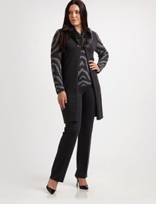 Dyed raccoon fur adds an exquisite touch to this stretch-wool duster with a fashion-forward oversized collar. You will adore the way this design pairs with your favorite pants.Detachable fur collarZebra-print sleevesSwarovski crystal closureAbout 38 from shoulder to hem95% wool/3% polyester/2% Lycra®Dry clean by fur specialistMade in ItalyFur origin: Finland