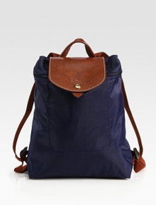 Sporty and timeless, this backpack version of the signature pliage design has adjustable straps and iconic leather trim. Adjustable backpack straps, 13-36½ drop Top zipper and snap flap closures Inside open pocket Fully lined Polyamide canvas/leather trim 12½W X 11H X 4D Imported Sporty and timeless, this backpack version of the signature pliage design has adjustable straps and iconic leather trim. Adjustable backpack straps, 13-36½ drop Top zipper and snap flap closures Inside open pocket Fully lined Polyamide canvas/leather trim 12½W X 11H X 4D Imported