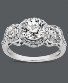 Stun them with sparkles! Arabella's glittering three stone ring features round-cut Swarovski zirconias (3-1/3 ct. t.w.) encircled by glittering zirconia accents. Crafted in sterling silver. Size 7. Stun them with sparkles! Arabella's glittering three stone ring features round-cut Swarovski zirconias (3-1/3 ct. t.w.) encircled by glittering zirconia accents. Crafted in sterling silver. Size 7.