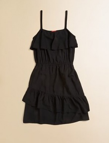Large ruffles adorn the A-line silhouette of this LBD for your little girl.Ruffled scoopneckSleevelessPullover styleElastic waistFull skirt100% rayonHand washMade in USA Large ruffles adorn the A-line silhouette of this LBD for your little girl.Ruffled scoopneckSleevelessPullover styleElastic waistFull skirt100% rayonHand washMade in USA