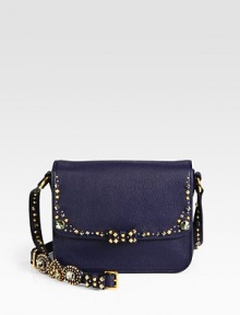 A supple leather design accented with studs, rhinestones and a sweet bow.Adjustable shoulder strap, 19-20 dropMagnetic snap flap closureThree inner compartmentsOne inside zip pocketOne inside open pocketSatin lining8½W X 6½H X 3¾DMade in Italy A supple leather design accented with studs, rhinestones and a sweet bow.Adjustable shoulder strap, 19-20 dropMagnetic snap flap closureThree inner compartmentsOne inside zip pocketOne inside open pocketSatin lining8½W X 6½H X 3¾DMade in Italy