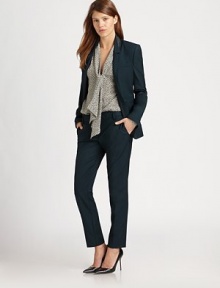 Flawlessly tailored blazer in a lengthy silhouette with front besom pockets and a back vent for easy movement. Notched shawl collarLong sleeves with buttoned cuffsFront besom pocketsSingle button closureBack ventFully linedAbout 26 from shoulder to hemBody: Polyester/viscose/elastaneContrast: PolyesterDry cleanImportedModel shown is 5'10 (177cm) wearing US size 2.