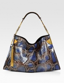 Elegantly redefined, this python shoulder bag embodies true '70's glamour. Hand colored by expert craftsmen, each version of this bag is unique.Periwinkle pythonAntique gold hardwareChain shoulder strap with leather detailMagnet snap closure on topInside zip, cell phone, and PDA pocketsNatural cotton linen liningMedium size: 17.3L x 1.4W x 11.4HMade in Italy Elegantly redefined, this python shoulder bag embodies true '70's glamour. Hand colored by expert craftsmen, each version of this bag is unique.Periwinkle pythonAntique gold hardwareChain shoulder strap with leather detailMagnet snap closure on topInside zip, cell phone, and PDA pocketsNatural cotton linen liningMedium size: 17.3L x 1.4W x 11.4HMade in Italy