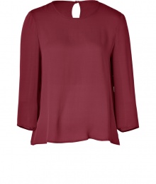 A fashionably boxier cut and a rich, autumnal hue lend this Tara Jarmon claret-hued silk top its easy elegance - Lightweight and especially flattering, thanks to a generous touch of stretch - Relaxed silhouette tapers gently through middle - Round neckline and 3/4 sleeves - Single-button closure and key hole detail at nape of neck - Fluid and feminine, seamlessly transitions from the office to evenings out - Pair with with cigarette pants, pencil skirts or leather leggings