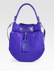 An easy style crafted of smooth nylon and contrast leather trim, finished with a stylish luggage tag. Leather top handle, 8 dropLeather removable adjustable shoulder strap, 17¾-20½ dropMagnetic top closureThree outside open pocketsOne inside zip pocketTwo inside open pocketsNylon lining14W X 13¾H X 2DImportedPlease note: Hardware color varies by bag. An easy style crafted of smooth nylon and contrast leather trim, finished with a stylish luggage tag. Leather top handle, 8 dropLeather removable adjustable shoulder strap, 17¾-20½ dropMagnetic top closureThree outside open pocketsOne inside zip pocketTwo inside open pocketsNylon lining14W X 13¾H X 2DImportedPlease note: Hardware color varies by bag.