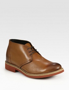 Superb craftsmanship with a burnished feel, in a smooth leather lace-up design with a rubber-lug sole.Leather upperLeather liningPadded insoleRubber soleMade in Italy Superb craftsmanship with a burnished feel, in a smooth leather lace-up design with a rubber-lug sole.Leather upperLeather liningPadded insoleRubber soleMade in Italy