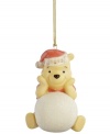 It's a snow day for Winnie the Pooh in this adorable porcelain ornament bearing the beloved Disney character. A dated Santa hat makes him extra irresistible.