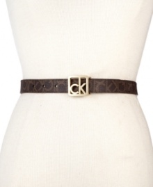 Give your look some signature style with this slender, chic belt from Calvin Klein, featuring the iconic CK logo in a gleaming, golden buckle. Give your look some signature style with this slender, chic belt from Calvin Klein, featuring the iconic CK logo in a gleaming, golden buckle.