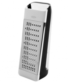 Your space is greater with this grater! Skip the mess & head straight to easy prep with this 2-in-1 container grater. Extra-sharp bi-directional stainless steel blades expertly slice, dice and shred zucchini, carrots, cheese, chocolate and more, which then fall into the built-in container with easy-to-read measurement markings, so your countertop stays clean and precision is always a given. Your space is greater with this grater! Skip the mess & head straight to easy prep with this 2-in-1 container grater. Extra-sharp bi-directional stainless steel blades expertly slice, dice and shred zucchini, carrots, cheese, chocolate and more, which then fall into the built-in container with easy-to-read measurement markings, so your countertop stays clean and precision is always a given.