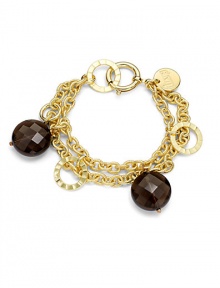 THE LOOKA graceful double chain with textured linksFaceted smoky quartz beads alternate with flat, polished open discsOversized spring ring claspTHE FITLength, about 7½THE MATERIALSmoky quartz18k gold platingORIGINMade in Italy THE LOOKA graceful double chain with textured linksFaceted smoky quartz beads alternate with flat, polished open discsOversized spring ring claspTHE FITLength, about 7½THE MATERIALSmoky quartz18k gold platingORIGINMade in Italy