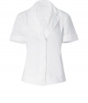 The classic white shirt gets a stylish kick from Donna Karan - Spread collar, concealed front button placket, short rolled sleeves, flattering tailored fit - Pair with a figure-hugging pencil skirt or cropped trousers, platform pumps, and a blazer