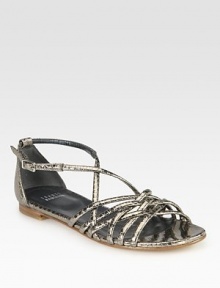 Metallic snake-embossed leather with a strappy front and an adjustable ankle strap. Snake-embossed leather upperLeather liningBuffed leather solePadded insoleImportedOUR FIT MODEL RECOMMENDS ordering one half size down as this style runs large. 