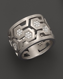 Brilliant diamonds pop against gleaming sterling silver in India Hicks' intriguing, geometric band ring.