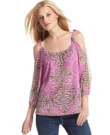 Fluid and exotically romantic, INC's printed blouse makes an alluring impression with sexy shoulder cutouts and delicate beading. Adjustable ties on top let you customize the look. Fluid and exotically romantic, INC's printed blouse makes an alluring impression with sexy shoulder cutouts and delicate beading. Adjustable ties on top let you customize the look.