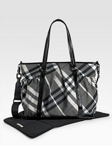 With the look of a classic tote, this check bag holds everything your baby needs in sophisticated Burberry style. Double handles, 10 drop Adjustable, detachable shoulder strap, 22 drop Top zip closure Outside open pouches Inside zip and open pockets Removable changing mat 17W X 13H X 6D PVC Imported