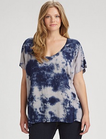 This tie-dye top might just be your new go-to style. It features an alluring v-neckline and a laid-back fit. Straight-leg jeans or skinnies would really complement this design.Deep v-neckShort sleevesRelaxed fitPull-on styleAbout 28 from shoulder to hemRayonMachine washMade in USA