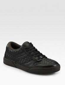 Classic low-top silhouette fashioned in a sleek, intricately woven design.Leather upperPadded insoleRubber soleMade in Italy Classic low-top silhouette fashioned in a sleek, intricately woven design.Leather upperPadded insoleRubber soleMade in Italy