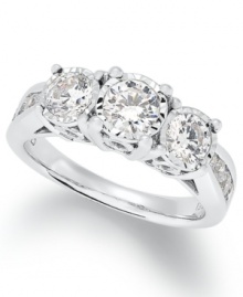 Give her the gift of forever. This stunning 3-stone ring features large round-cut diamonds (1-1/2 ct. t.w.) and smaller, channel-set diamonds in the band. Crafted in 14k white gold. Give her the gift of forever. This stunning 3-stone ring features large round-cut diamonds (1-1/2 ct. t.w.) and smaller, channel-set diamonds in the band. Crafted in 14k white gold.