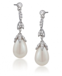 Fit for a princess. Carolee's elegant linear teardrop earrings convey a regal bearing. Adorned with glass pearls and sparkling glass accents, they're crafted in silver tone mixed metal. Approximate drop: 1-1/2 inches. Fit for a princess. Carolee's elegant linear teardrop earrings convey a regal bearing. Adorned with glass pearls and sparkling glass accents, they're crafted in silver tone mixed metal. Approximate drop: 1-1/2 inches.