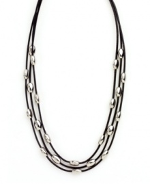 Let sleek beads add extra polish to your look. Nine West's chic three row necklace features leather cords strung with oval-shaped beads in silver tone mixed metal. Approximate length: 16 inches. Let sleek beads add extra polish to your look. Nine West's chic three row necklace features leather cords strung with oval-shaped beads in silver tone mixed metal. Approximate length: 16 inches.