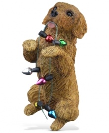 A fetching gift for animal lovers, the golden retriever Christmas ornament depicts a doe-eyed pup eager to deck the halls. From Sandicast.