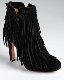 Tiers of fringe trickle down Jean-Michel Cazabat's Pepe boots--part western, part bohemian.
