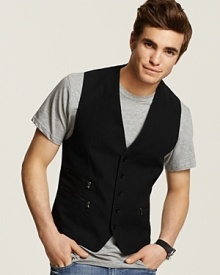 Like a vintage thrift store find, this vest is rendered with faded pinstripes allover, button front and buckle detail at the back. Like a vintage thrift store find, this vest is rendered with faded pinstripes allover, button front and buckle detail at the back.