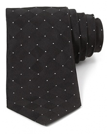 The subtle tonal weave pattern of this skinny silk tie is balanced by allover dots for an exceptionally cool dimensional effect. The subtle tonal weave pattern of this skinny silk tie is balanced by allover dots for an exceptionally cool dimensional effect.