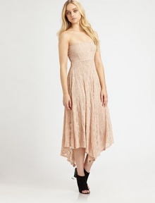 Give into your desires with this romantic strapless dress, covered in the finest Victorian lace from France. StraplessEmpire waistA-line silhouetteAllover layered scalloped laceHigh-low hemFully linedAbout 26 from natural waist89% polyamide/8% elathane/3% viscoseDry cleanMade in USAModel shown is 5'9 (176cm) wearing US size Small.