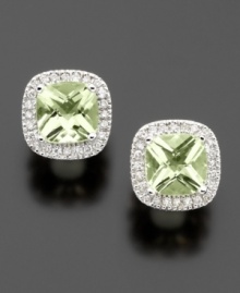 The serene color of cushion-cut green quartz (2-1/5 ct. t.w.) pairs perfectly with sparkling round-cut diamonds (1/4 ct. t.w.) in elegant 14k white gold.