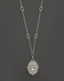 White sapphires accent mother-of-pearl in a sterling silver setting. By Judith Ripka. White sapphires accent mother-of-pearl in a sterling silver setting. By Judith Ripka.