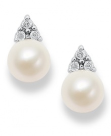 Polished to a T. These simple, yet stunning, stud earrings highlight cultured freshwater pearls (7 mm) and a pretty crown of diamond accents. Approximate diameter: 1/2 inch. Polished to a T. These simple, yet stunning, stud earrings highlight cultured freshwater pearls (7 mm) and a pretty crown of diamond accents. Approximate diameter: 1/2 inch.