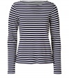 Work a nautical edge into your casual favorites with Theorys navy and white striped top - Boat neckline, long sleeves - Fitted - Wear with bright white separates and timeless leather accessories