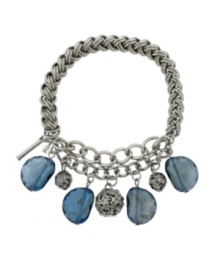 Well rounded. Stylish spherical charms complement faceted glass accents in a cool blue hue on this stretch bracelet from Kenneth Cole New York. Set in silver tone mixed metal, it includes a signature gift box. Approximate length: 7-1/2 inches.