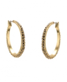 Gorgeous and glittering. Dazzling crystal accents add a dynamic dimension to Kenneth Cole New York's hoop earrings. Crafted in gold tone mixed metal. Approximate diameter: 1-1/10 inches.